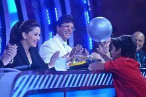 Madhuri Dixit and Jaaved Jaaferi sharing a light moment with a participant 